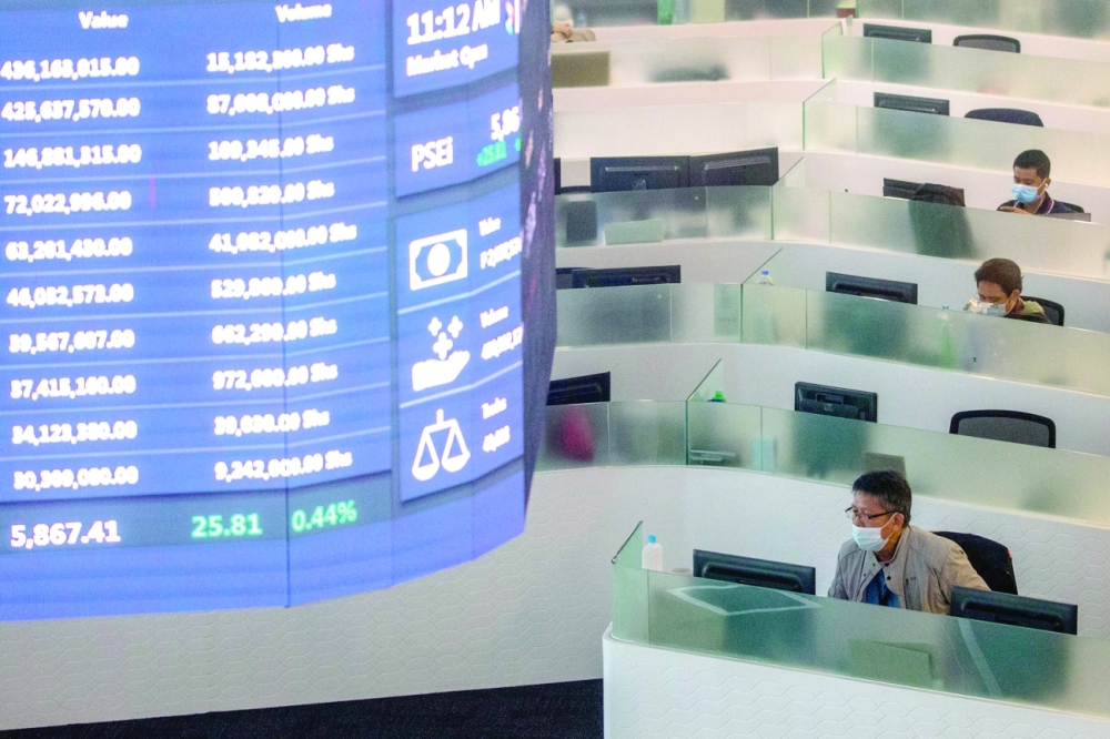 Traders work on the trading floor of the Philippine Stock Exchange amid the coronavirus disease outbreak, in Taguig City, Metro Manila. - Reuters
