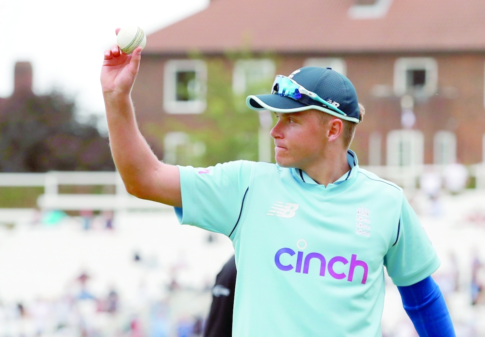 England's Sam Curran with the match ball after taking five wickets in the innings. -- Reuters