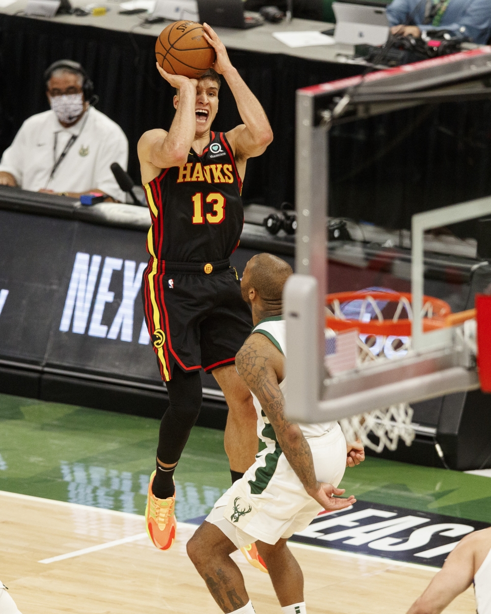Atlanta Hawks guard Bogdan Bogdanovic (13) shoots during the fourth quarter against the Milwaukee Bucks. -- USA Today Sports