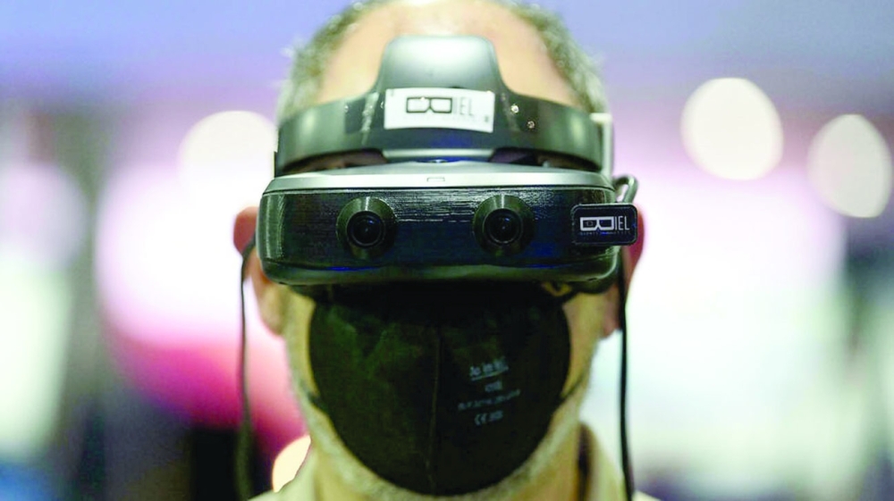 A man uses Biel digital glasses that help people with limited sight better perceive their surroundings. - AFP