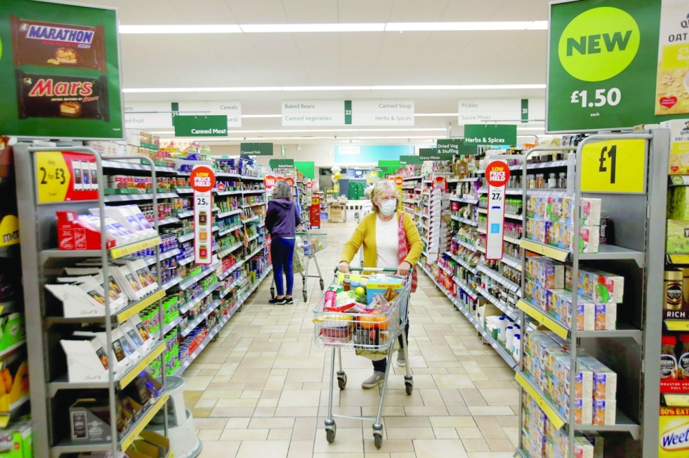 Shoppers are seen inside Morrisons super market in central London. — AFP