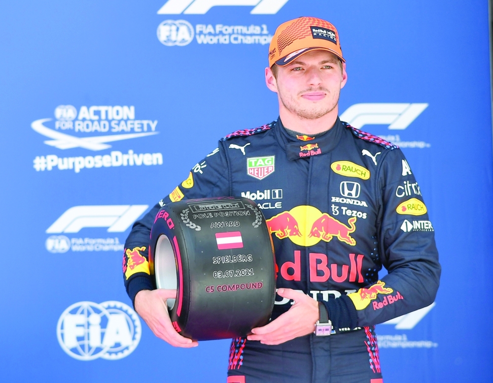 Red Bull's Max Verstappen reacts after qualifying in pole position. -- Reuters