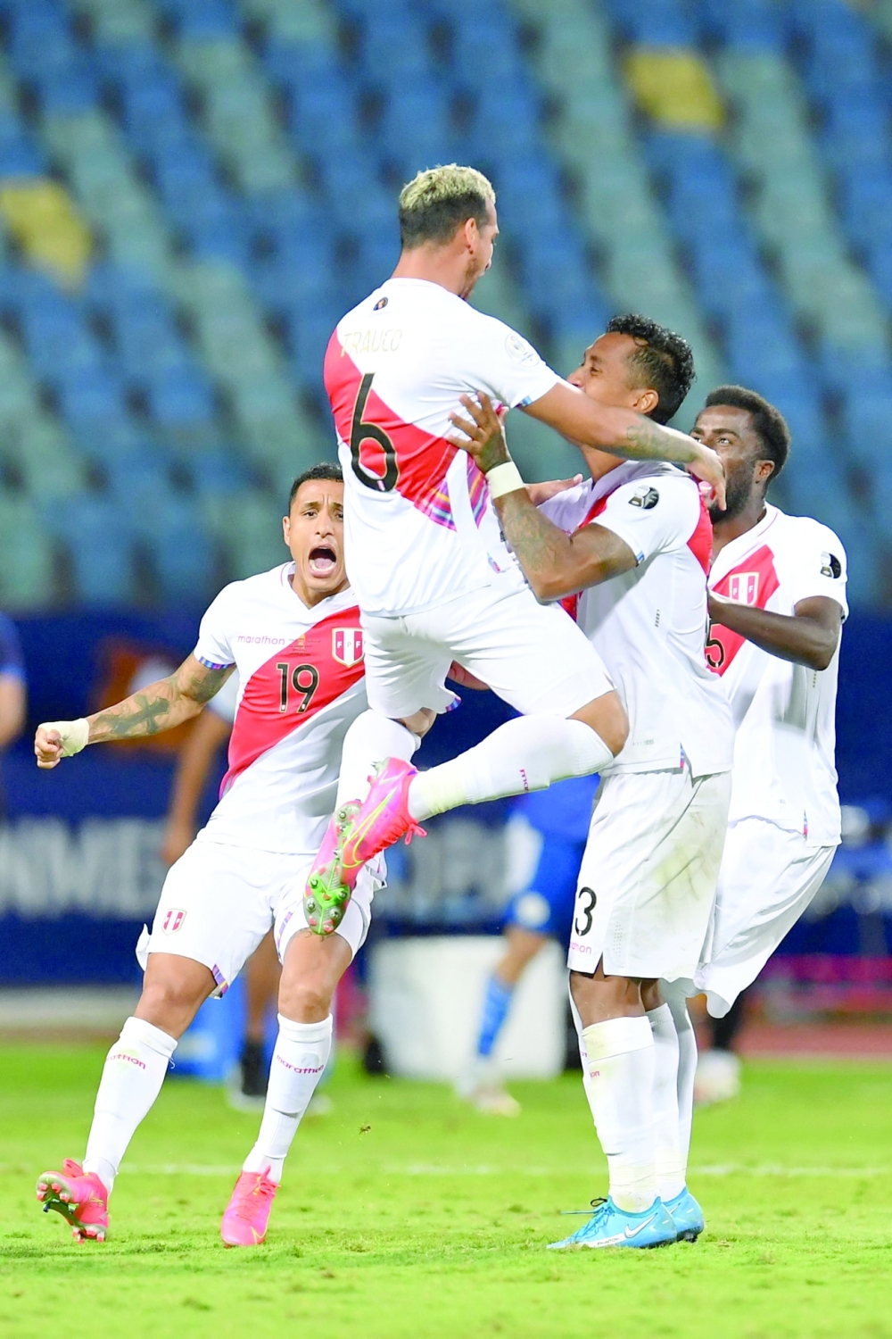 Peru's Miguel Trauco celebrates with teammates after scoring the defining goal. -- AFP