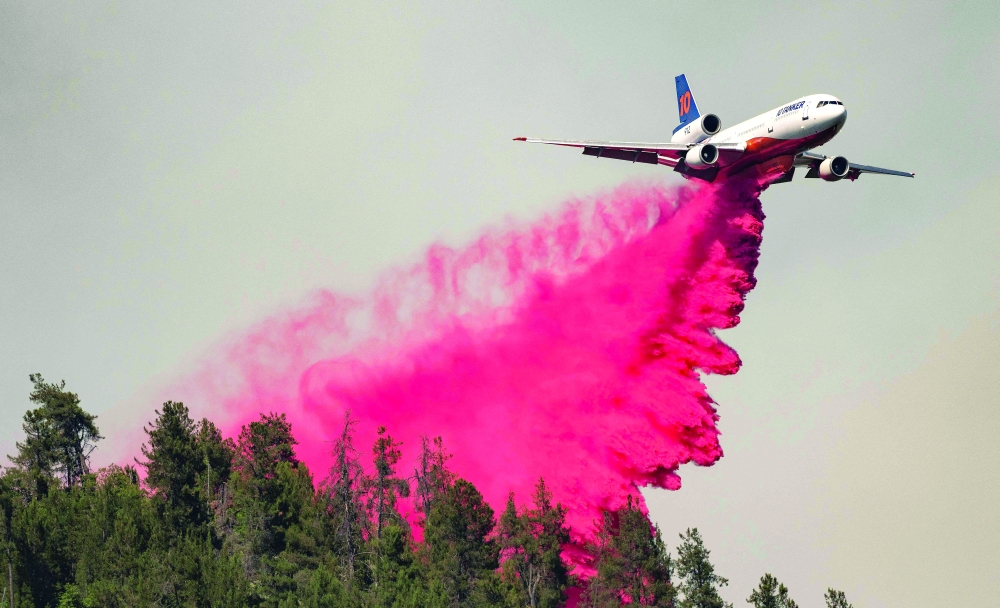 An air tanker drops retardant along a ridge during the Salt fire in Lakehead, California. - AFP 