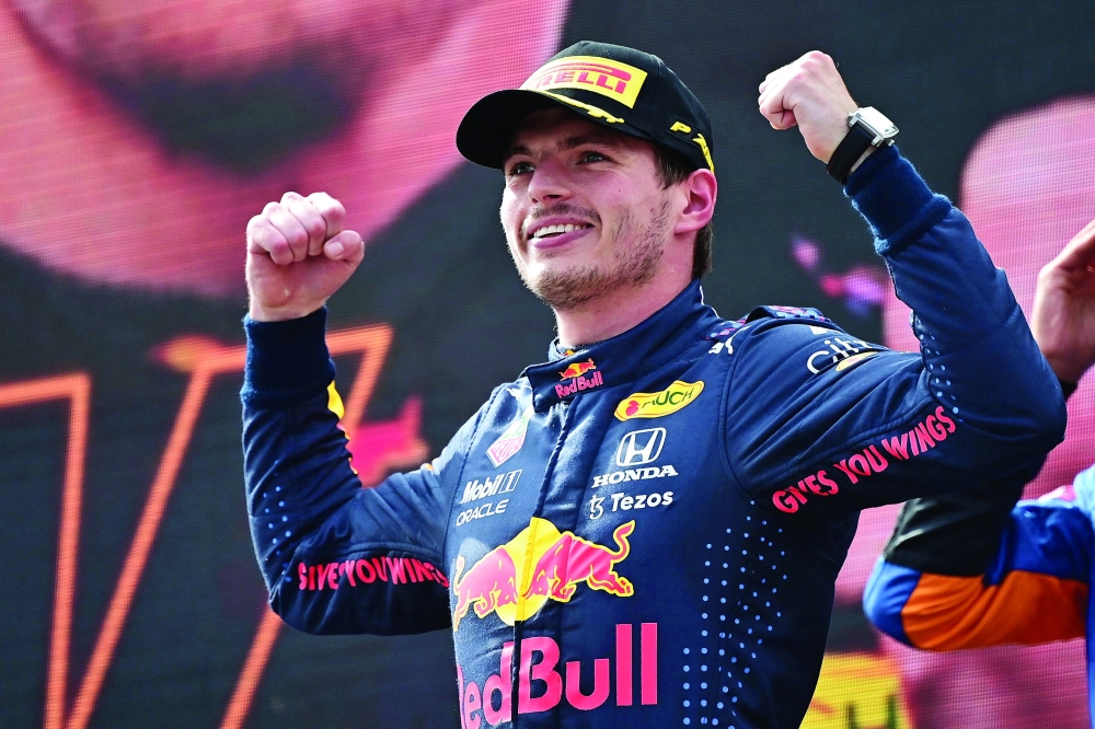 Red Bull's Dutch driver Max Verstappen celebrates on the podium after winning the Formula One Austrian Grand Prix at the Red Bull Ring race track in Spielberg, Austria, on July 4, 2021. / AFP / ANDREJ ISAKOVIC

