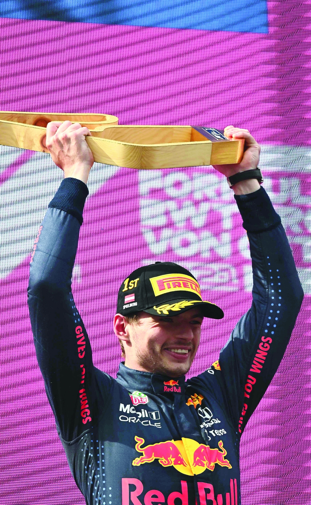Red Bull's Dutch driver Max Verstappen celebrates on the podium after winning the Formula One Austrian Grand Prix at the Red Bull Ring race track in Spielberg, Austria, on July 4, 2021. / AFP / Joe Klamar

