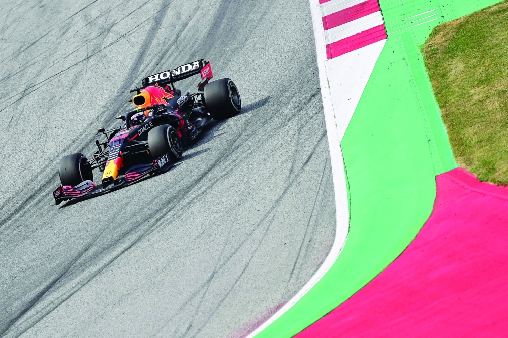 Red Bull's Dutch driver Max Verstappen competes to win the Formula One Austrian Grand Prix at the Red Bull Ring race track in Spielberg, Austria, on July 4, 2021. / AFP / ANDREJ ISAKOVIC

