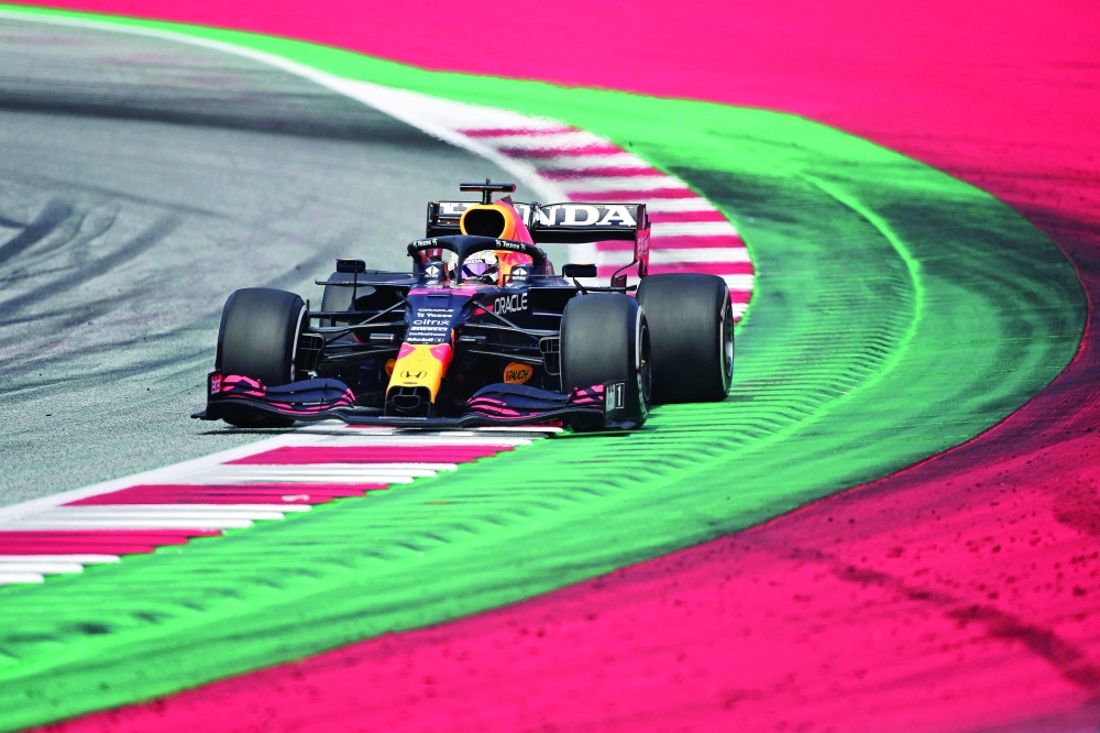 Red Bull's Dutch driver Max Verstappen competes to win the Formula One Austrian Grand Prix at the Red Bull Ring race track in Spielberg, Austria, on July 4, 2021. / AFP / ANDREJ ISAKOVIC

