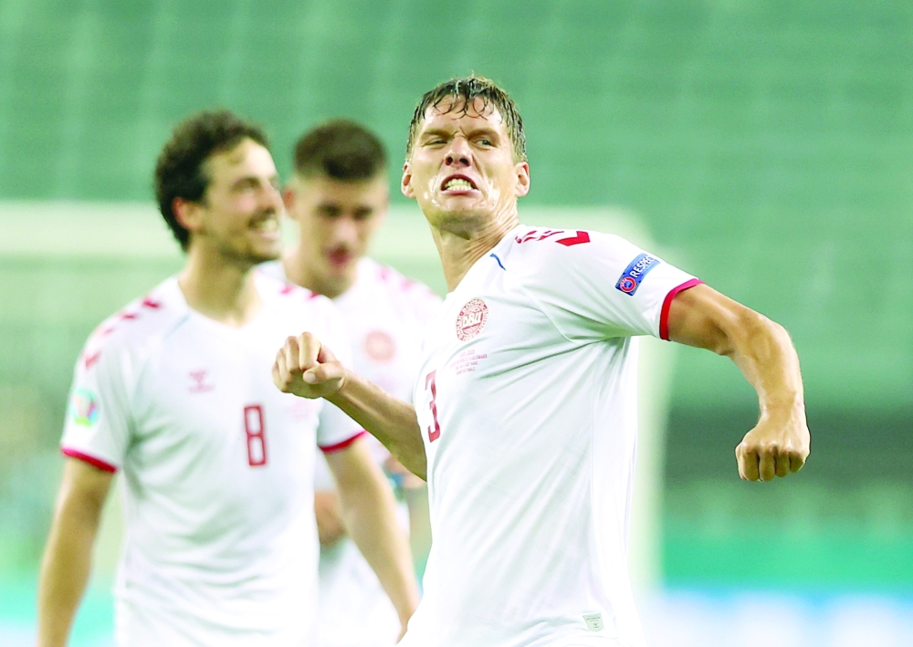 Denmark's Jannik Vestergaard celebrates after the match. -- Reuters