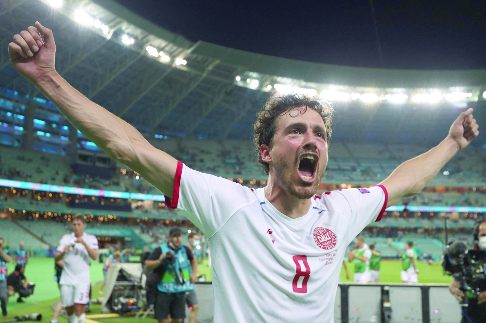 Denmark's midfielder Thomas Delaney celebrates at the end of the UEFA EURO 2020 quarterfinal. -- AFP