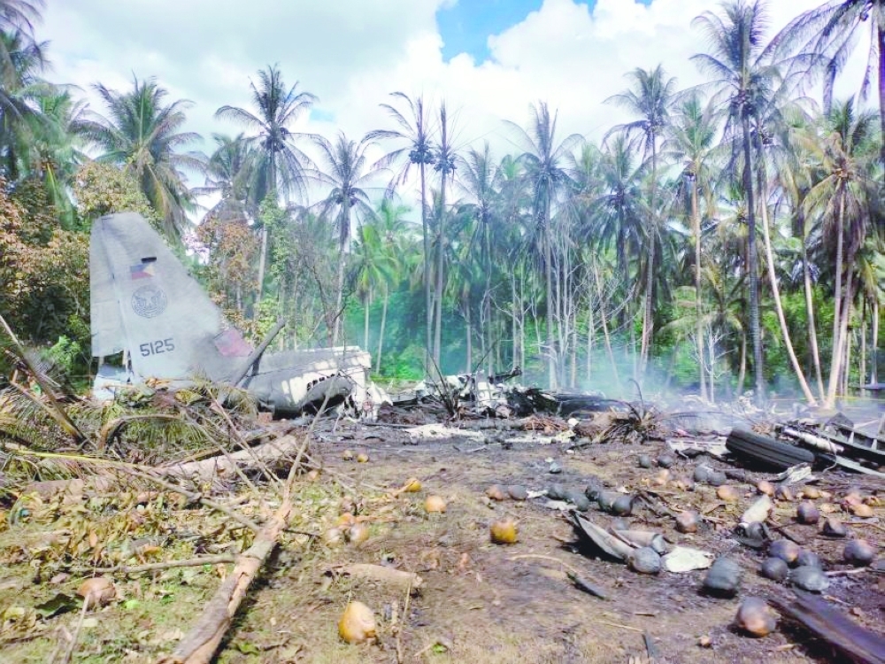 View of the site after a Philippines Air Force Lockheed C-130 plane carrying troops crashed on landing in Patikul, Sulu province, Philippines. - Reuters