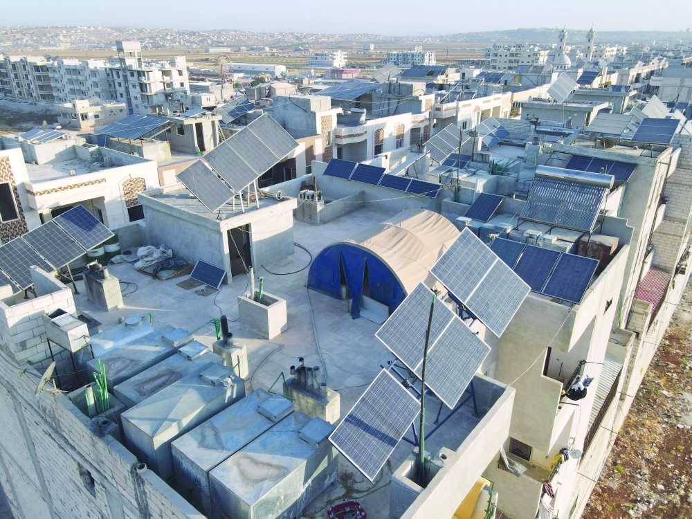 Solar panels on the rooftops of buildings in the town of Dana, east of the Turkish-Syrian border in the northwestern Syrian Idlib province. - AFP