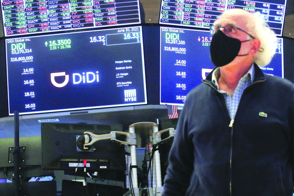 A trader works during the IPO for Didi Global Inc on the New York Stock Exchange floor in New York City. — Reuters