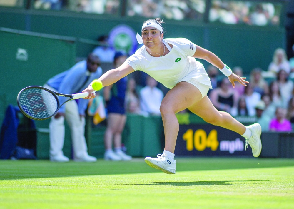 Tennis - Wimbledon - All England Lawn Tennis and Croquet Club, London, Britain - July 2, 2021 Tunisia's Ons Jabeur in action during her third round match against Spain's Garbine Muguruza REUTERS/Aeltc/edward Whitaker
