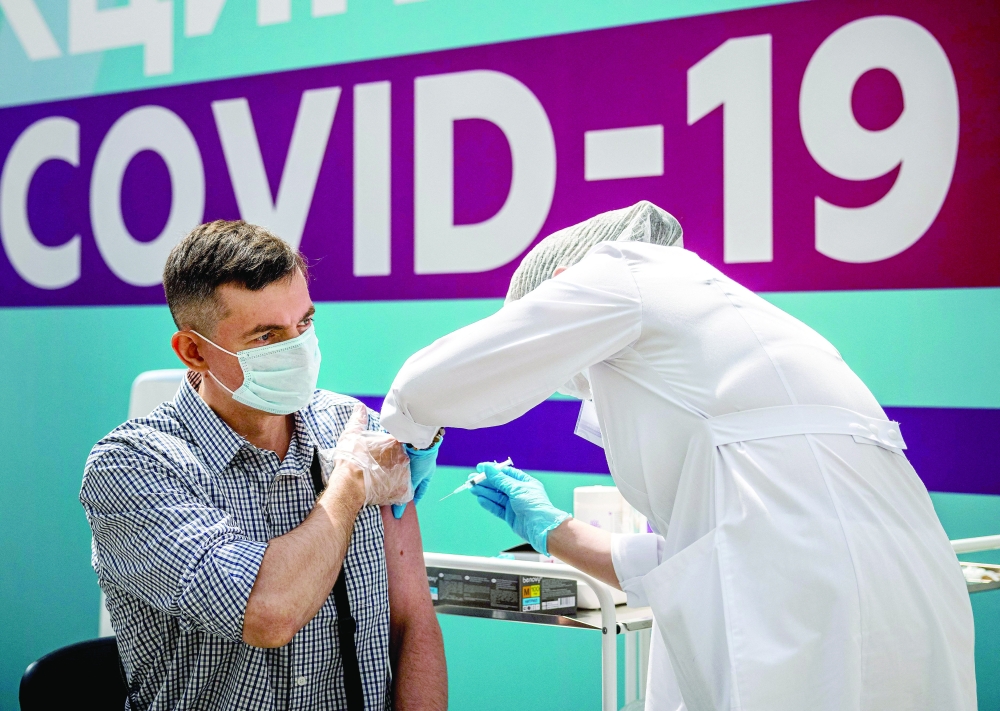 A man receives a dose of vaccine in Moscow on Wednesday. -- AFP