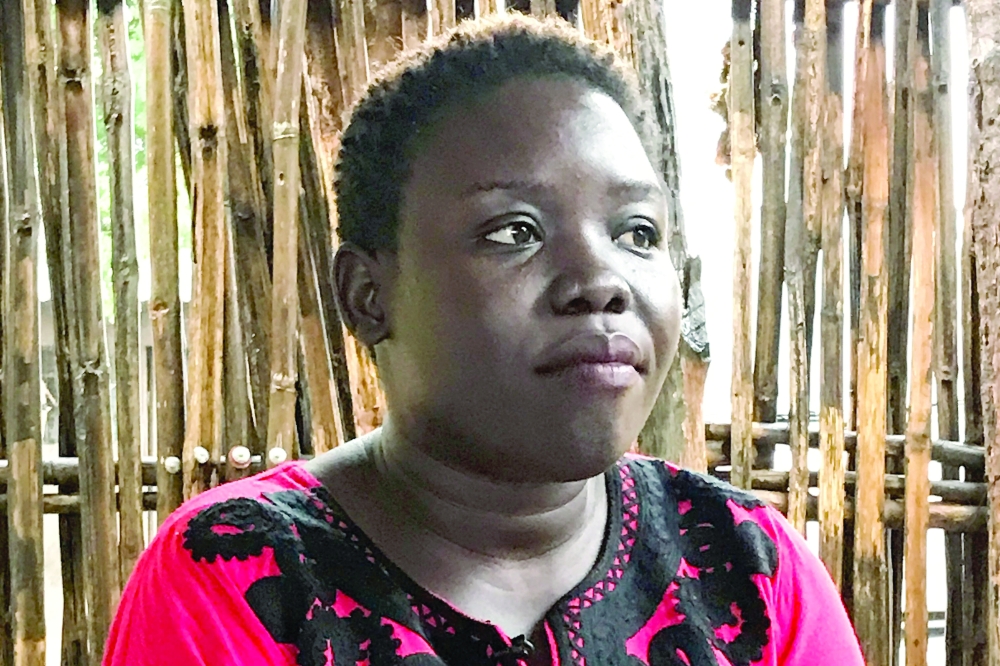 Nunu Diana, a social worker and mother of four, poses at her house in Lemon Gaba, near Juba. - AFP