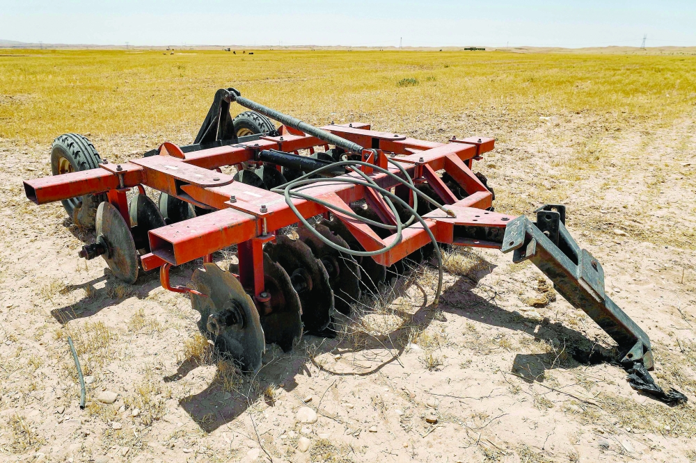 A view of a plough in a dried up agricultural field in the Saadiya area, north of Diyala in eastern Iraq. - AFP