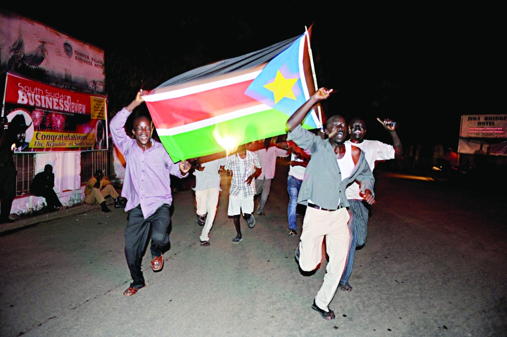 Residents of Juba in South Sudan celebrate in the streets the birth of their new nation on July 9, 2011. -- AFP