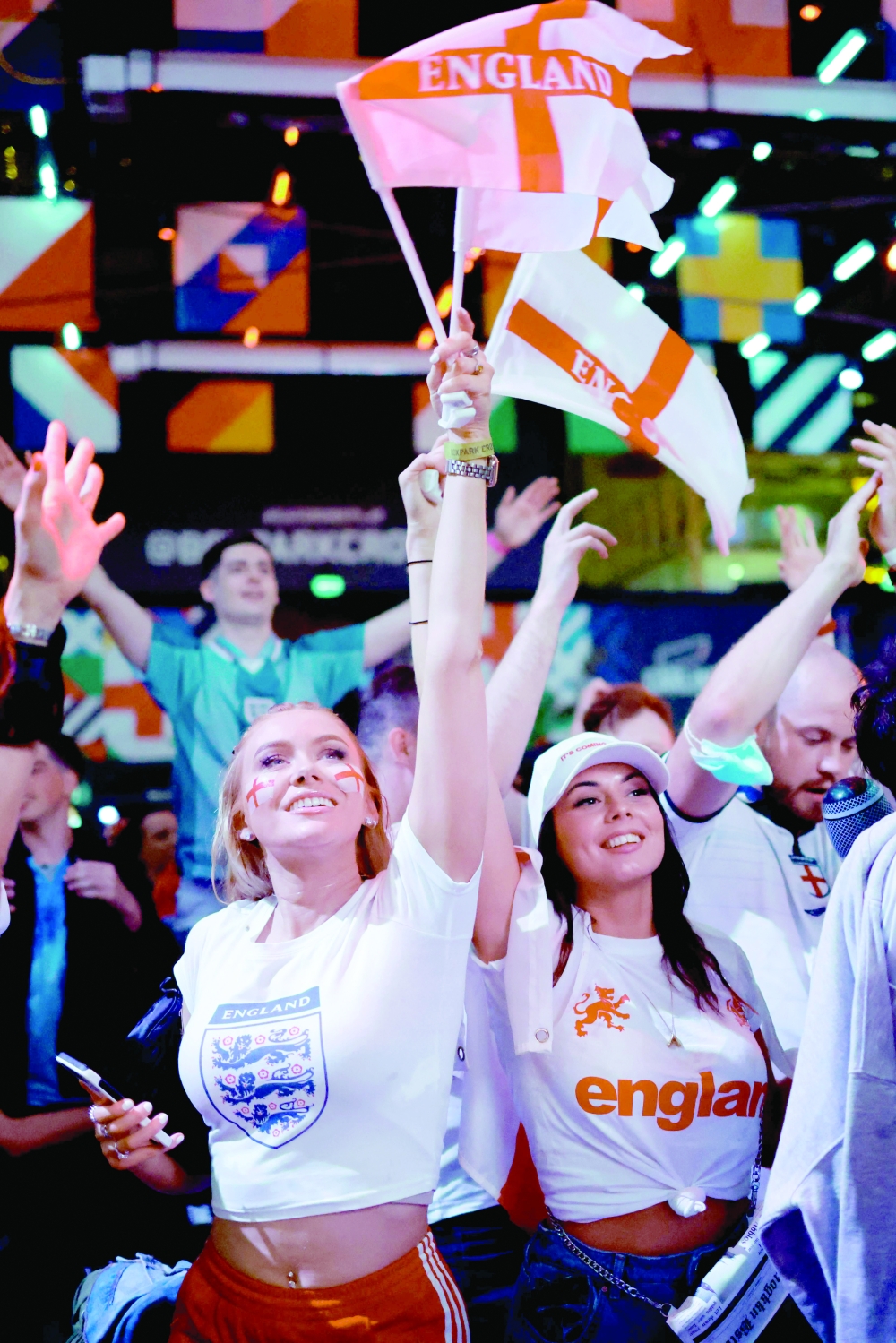 England supporters celebrate victory at the final whistle of the Euro 2020 semifinal against Denmark, at Boxpark Croydon in south London. -- AFP