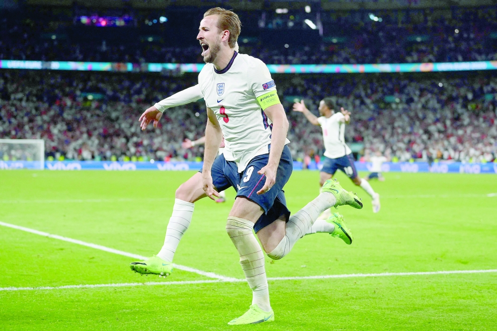 England's Harry Kane (C) celebrates after scoring the second goal. -- AFP