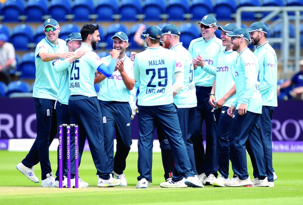 England's Saqib Mahmood celebrates taking the wicket of Pakistan's Imam-ul-Haq with teammates. -- Reuters