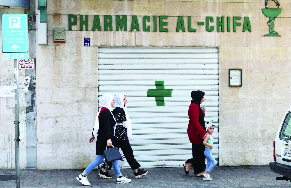 A shuttered door of a pharmacy in the Lebanese capital Beirut. - AFP