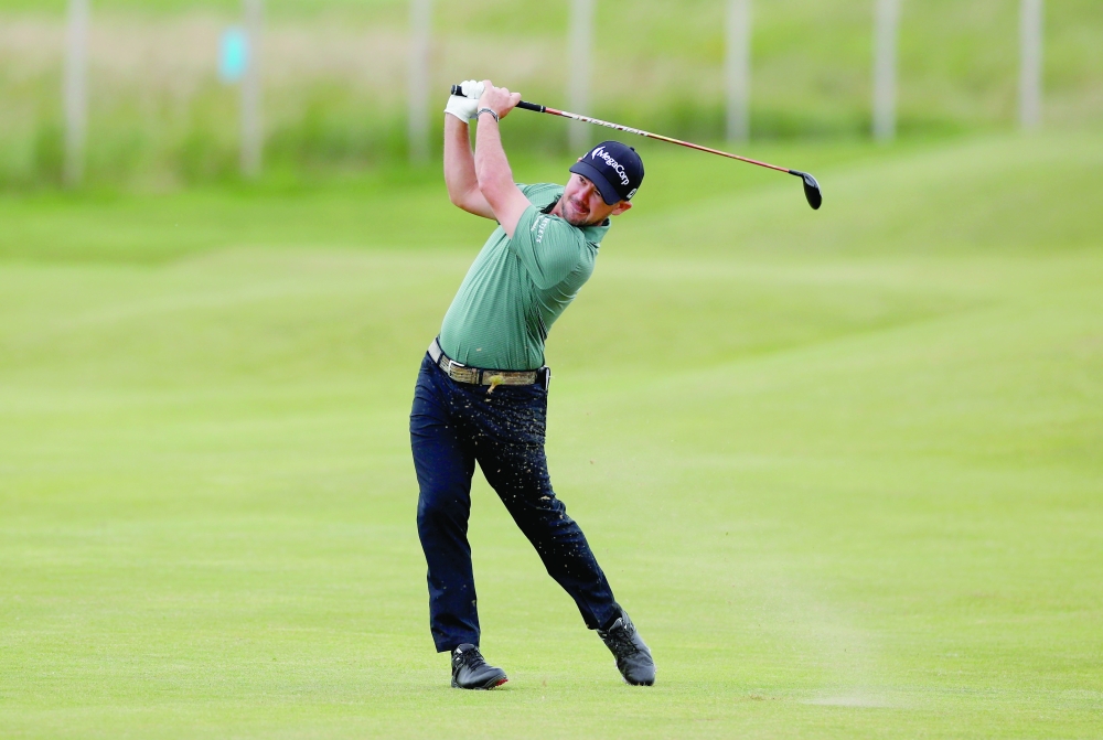 Brian Harman of the US in action during the first round of the 149th Open Championship. -- Reuters