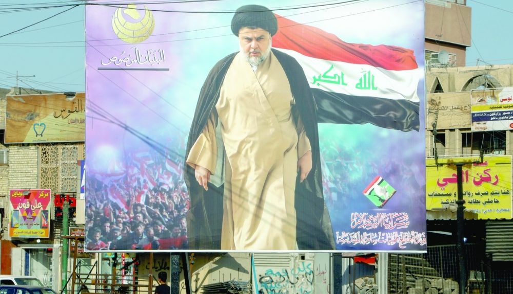 A poster of Moqtada al-Sadr in the Sadr City district of Baghdad. -- Reuters