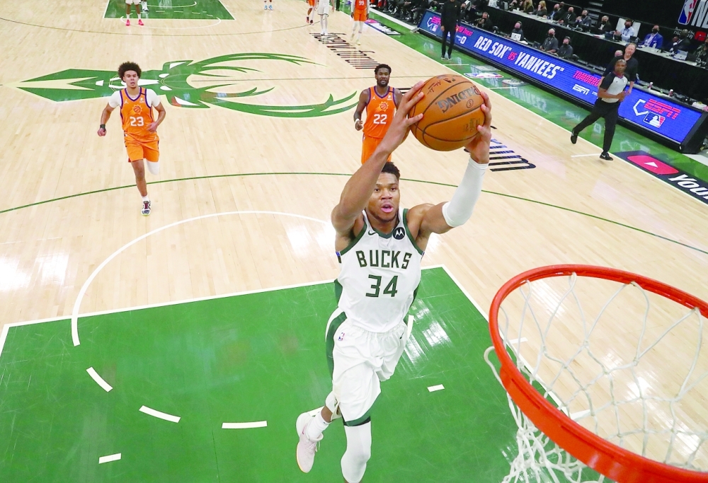 Milwaukee Bucks forward Giannis Antetokounmpo (34) drives to the basket against the Phoenix Suns during game four of the 2021 NBA Finals at Fiserv Forum. -- USA TODAY Sports
