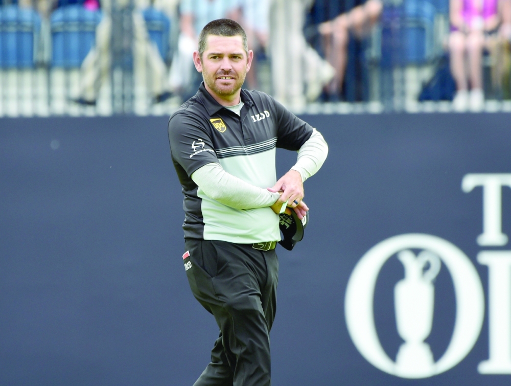 South Africa's Louis Oosthuizen celebrates during the first round. -- Reuters