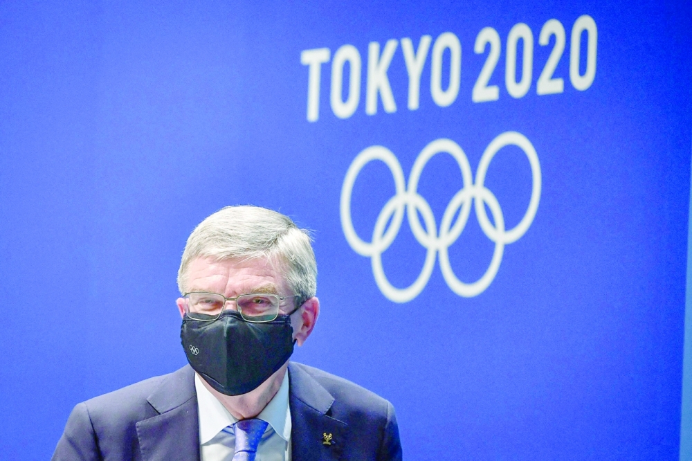 International Olympic Committee (IOC) president Thomas Bach leaves following a news conference. -- AFP 