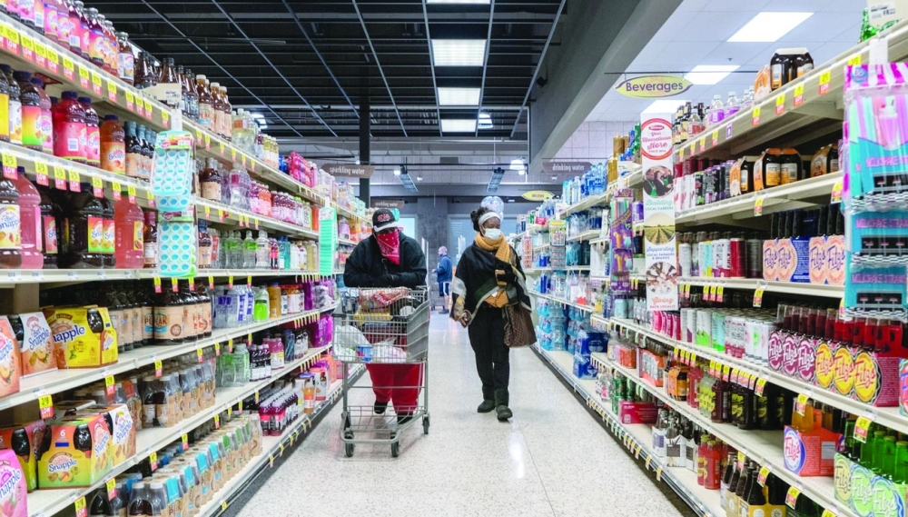 Shoppers browse in a supermarket while wearing masks in St Louis, Illinois. — Reuters