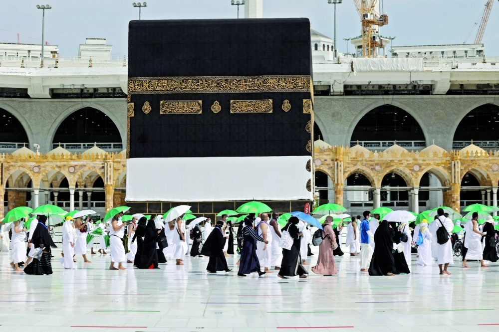 Pilgrims arrive at the Grand mosque in the holy city of Meccca at the start of the Haj season on Saturday. - AFP