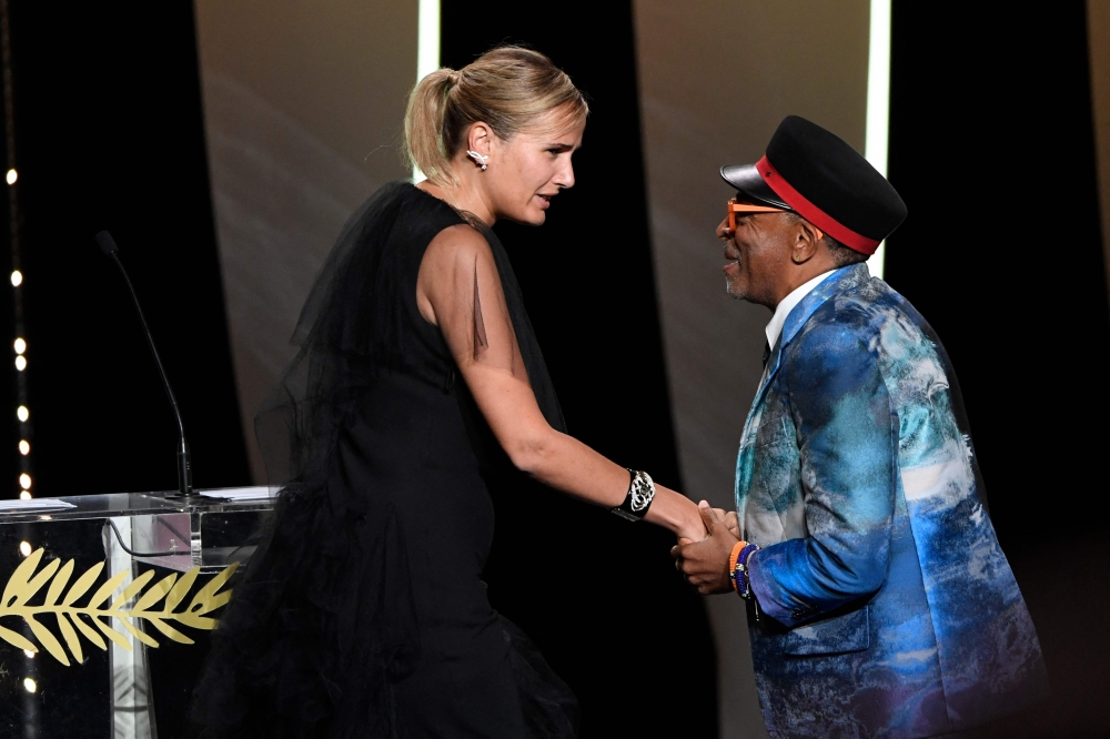 French director Julia Ducournau (L) thanks US director and Jury President of the 74th Cannes Film Festival 
