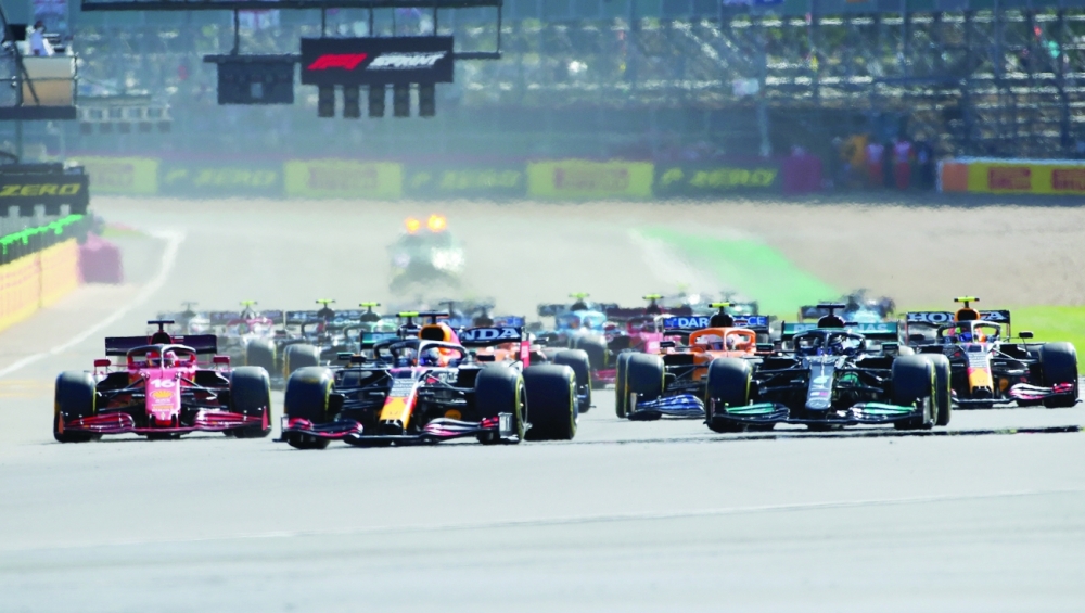 Red Bull's Max Verstappen leads over Mercedes' Lewis Hamilton and Ferrari's Charles Leclerc at the start of sprint qualifying. -- Reuters