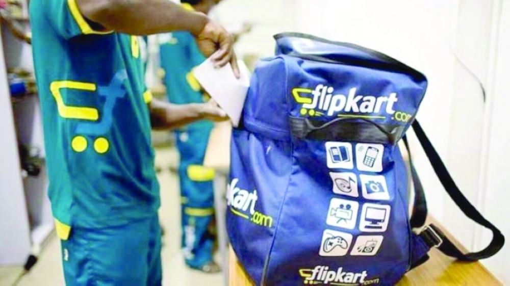 A man prepares his bag for delivery of parcels and packages in Flipkart’s headquarters in New Delhi. — Reuters