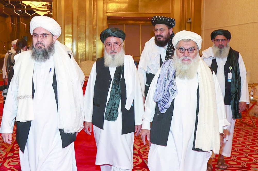 A delegation of Afghanistan's Taliban movement attends a session of the peace talks between the Afghan government and the Taliban in Doha. - AFP

