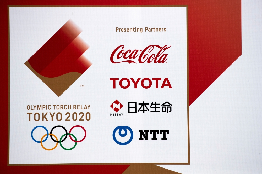 A banner advertising Coca-Cola beverages, Toyota, Nissay and NTT, Olympic Games partner for Tokyo 2020, in Fukushima, Japan. -- Reuters