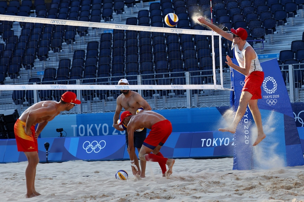 Mirco Gerson of Switzerland trains with Adrian Gavira Collado and Pablo Herrera Allepuz of Spain during training. -- Reuters