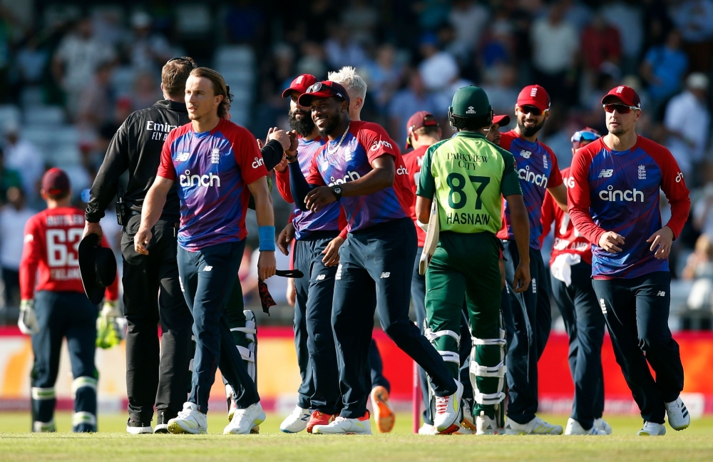 England's Tom Curran and teammates celebrate after the match. -- Reuters