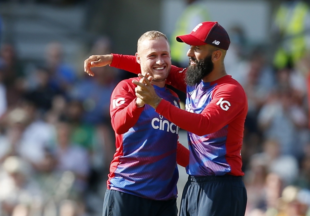 England's Matt Parkinson celebrates with Moeen Ali after taking the wicket of Pakistan's Azam Khan. -- Reuters