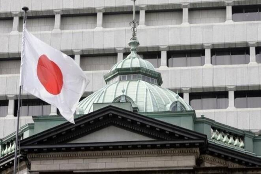 A flag waves in front of Bank of Japan’s headquarters in Tokyo. — Reuters