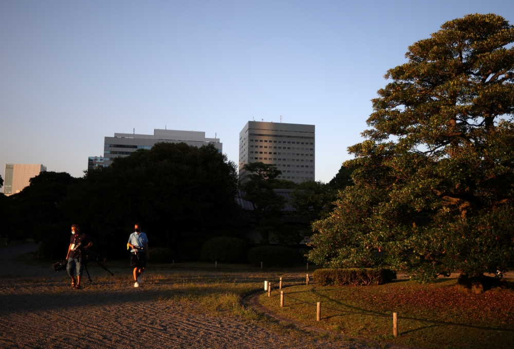 Members of the media visit in Hama-rikyu Gardens during an escorted and controlled tour for media representatives, ahead of the Tokyo 2020 Olympic Games, in Tokyo. -- Reuters