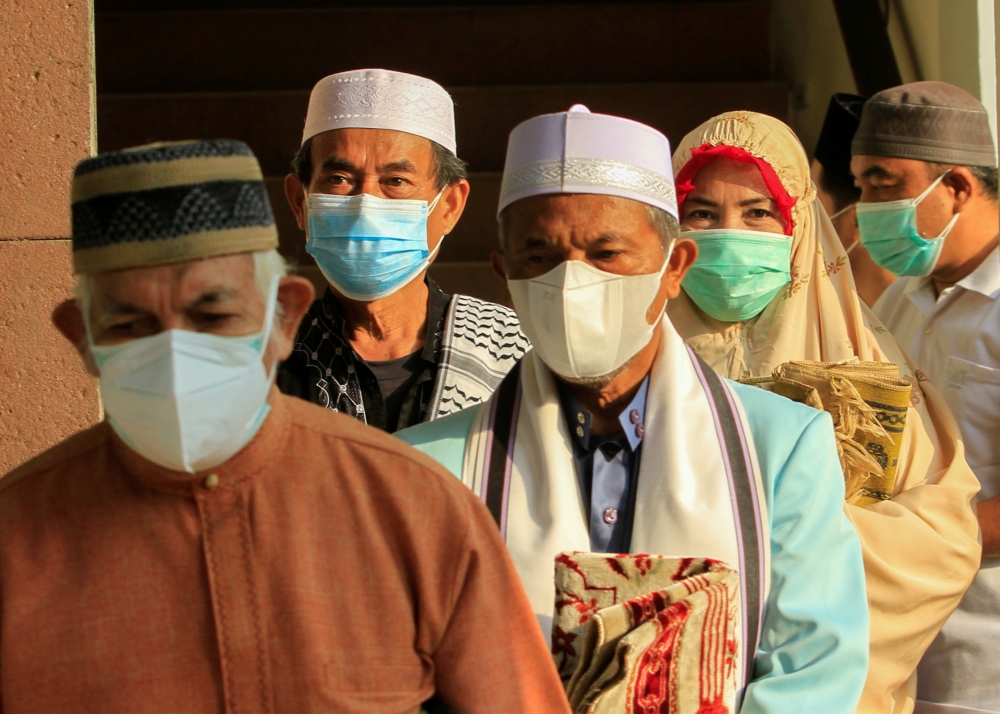 Indonesian Muslims offer Eid prayers at a mosque amid a surge of coronavirus disease cases in Bogor, on the outskirts of Jakarta. - Reuters
