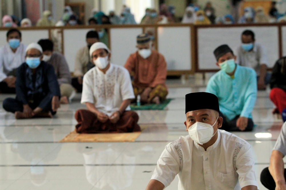Indonesian Muslims offer Eid prayers at a mosque amid a surge of coronavirus disease cases in Bogor, on the outskirts of Jakarta. - Reuters
