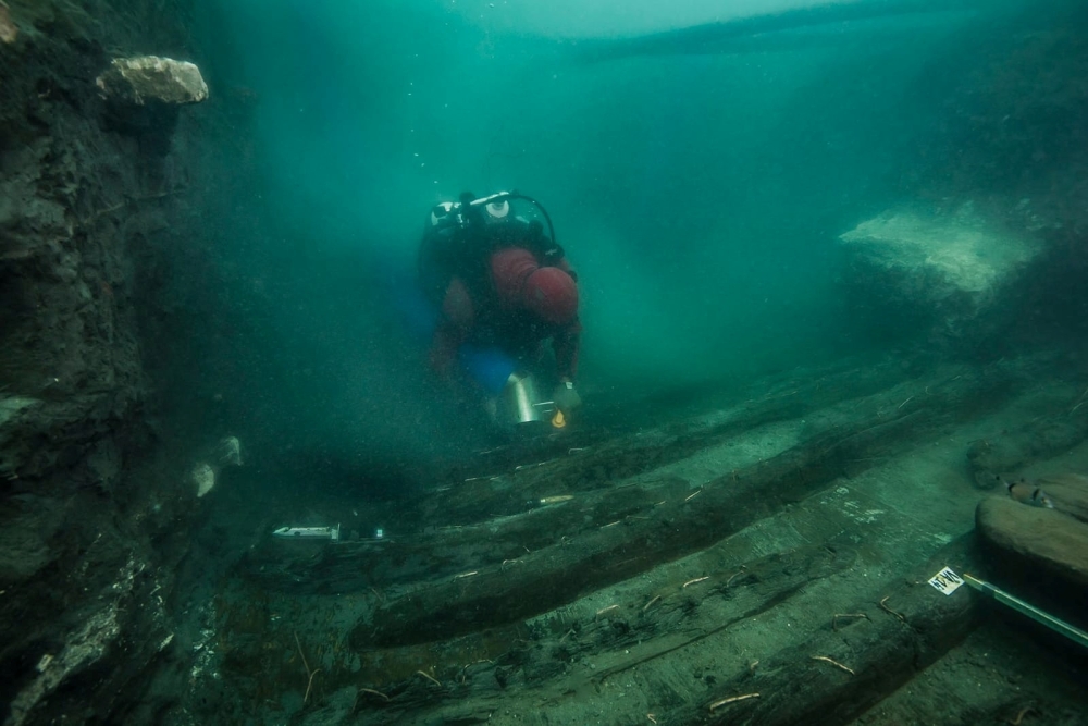 A diver examines the remains of an ancient military vessel discovered in the Mediterranean sunken city of Thonis-Heracleion off the coast of Alexandria on Monday. -- Reuters