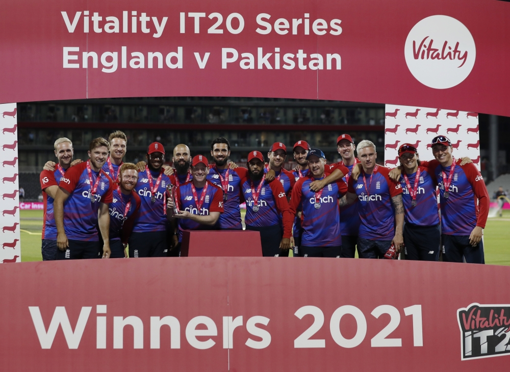 England players celebrate winning the third T20 and the series against Pakistan. -- Reuters