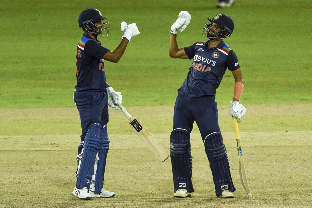 India's Deepak Chahar (R) and Bhuvneshwar Kumar gesture during the second ODI against Sri Lanka. -- AFP 