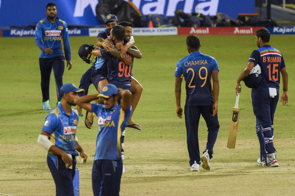India's Deepak Chahar (C) celebrates with his teammates after India defeated Sri Lanka. -- AFP