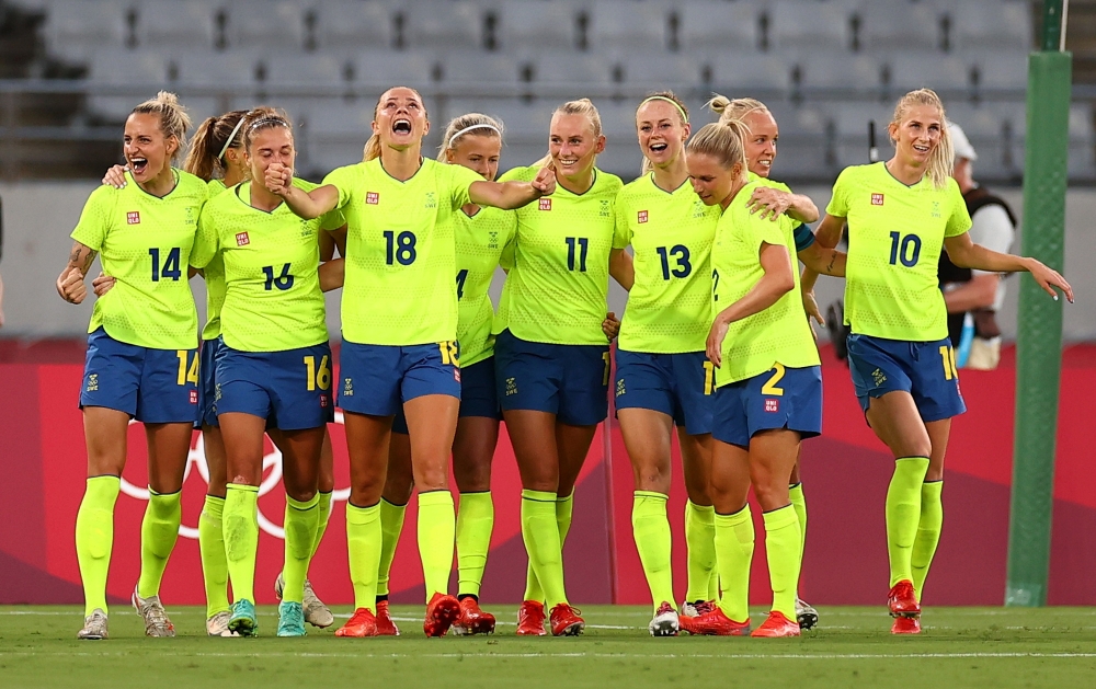 Stina Blackstenius of the Sweden celebrates scoring their second goal with teammates. -- Reuters